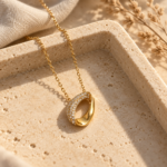 Close up view of the gold plated necklace with paved crystals
