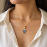 Model wearing a shimmering Hamsa pendant gold plated necklace