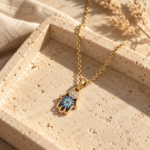 Elegant golden necklace with blue and white stone Hamsa pendant