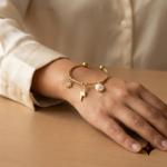 Model wearing Celestial Charm Gold Bracelet on wrist