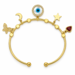 A luxurious gold plated evil eye bracelet with butterfly, moon, star, and heart charms on a white background