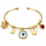 A close-up studio shot of a gold plated evil eye bracelet featuring delicate charms