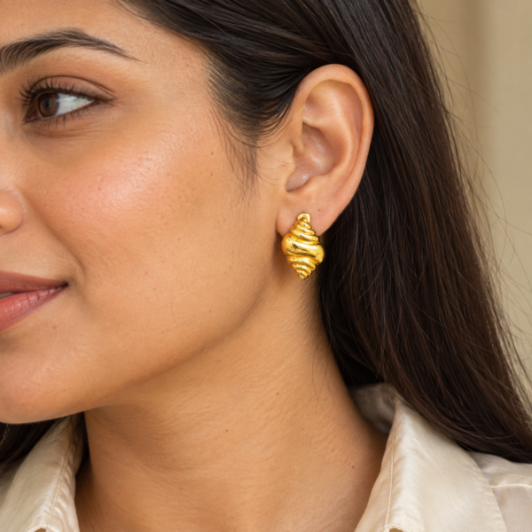 A model wearing elegant Conch Shell Golden Earrings