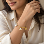 Woman wearing the Flora Pearl Golden Kada on her wrist