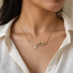Close up of Flora Vine Gold Necklace on model