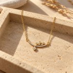 Flora Vine Gold Necklace showcasing leaf and blossom design