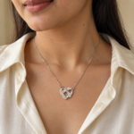 Model wearing an Intertwined Heart Pendant necklace