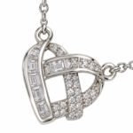 Detailed view of the sparkling stones on the Intertwined Heart Pendant