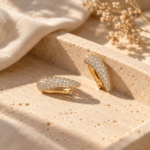 Pair of gold plated huggies with pave stones