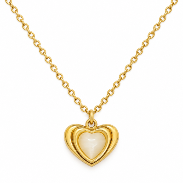 lumina pearl heart necklace feat A delicate gold chain featuring a sculptural heart pendant with a glowing mother of pearl center
