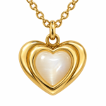 Close-up of the heart-shaped pendant with its polished gold frame and smooth iridescent center