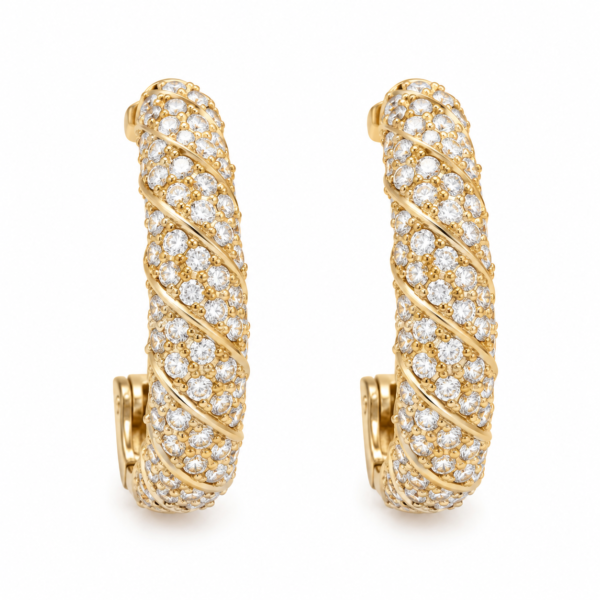 pav twist gold hoop earrings feat Pair of gold pavé twist hoop earrings on white background