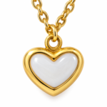 Close up of the mother of pearl heart pendant on a gold chain