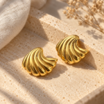 Pair of Shell Radiance Gold Plated Studs on white background