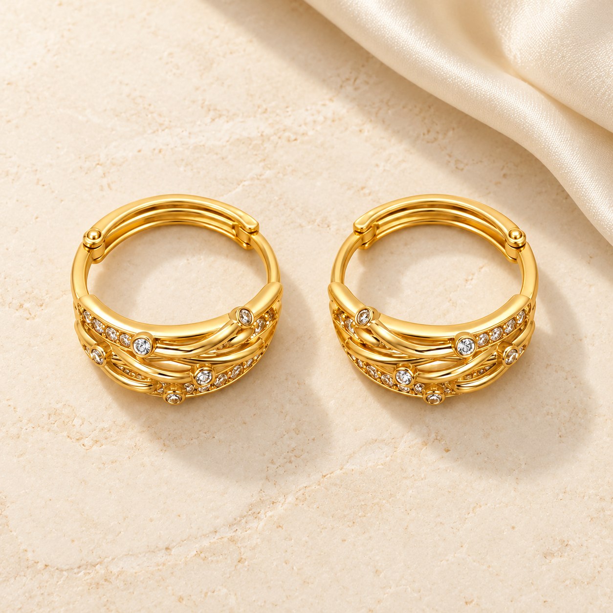 Gold plated crystal hoop earrings on ivory stone and silk