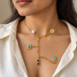 Close up of a model wearing the gold-plated charm Y necklace