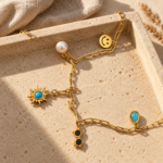 Gold-plated charm Y necklace with turquoise sun charm and pearl