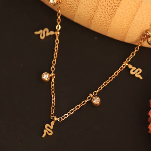 Serpent's Whisper Charm Necklace